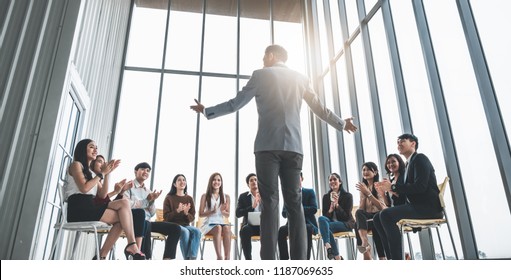 Business people clapping hands during meeting in office for their success in business work - Shutterstock ID 1187069635