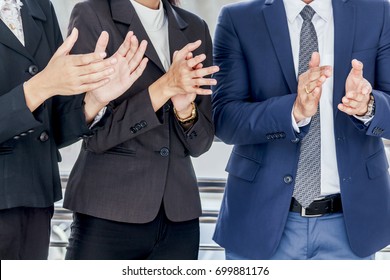 Business people clapping hands in the meeting