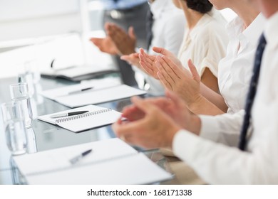 Business People Clapping At A Meeting In The Office