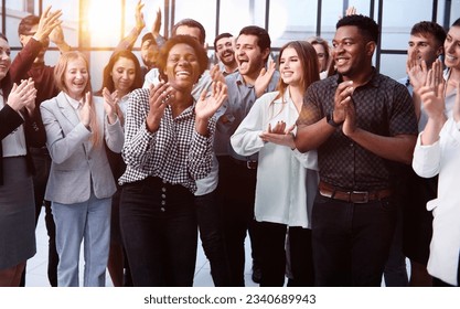 Business people clapping their hands after a seminar - Powered by Shutterstock