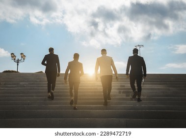 Business people climb the city stairs. Close-up of the impersonal legs rising up. Career growth and advancement. Increasing and improving skills. Salary increase - Powered by Shutterstock