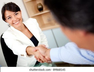 Business People Closing A Business Deal With Handshake