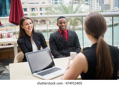 Business people at a coffee shop. - Shutterstock ID 474915403