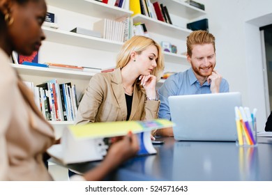 Business People Collaborate In Office And Work On Computer