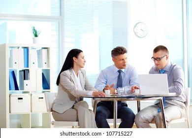 Business People Collaborating At The Round Table Indicating Their Equality