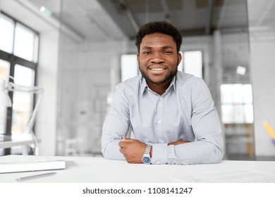 business and people concept - smiling african american businessman at office - Shutterstock ID 1108141247