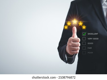 Business people or customers show satisfaction through the application on the laptop screen. By giving the most or the best satisfaction rating.Customer service satisfaction survey concept - Shutterstock ID 2108796872