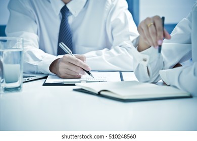 Business people discussing the charts and graphs showing the results of their successful teamwork - Shutterstock ID 510248560