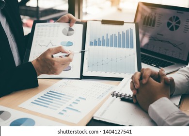 Business people discussing with colleagues with entrepreneurs are planning finance in office room. - Powered by Shutterstock