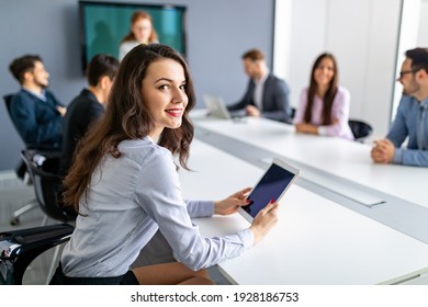 Business people discussing documents and ideas at meeting - Shutterstock ID 1928186753
