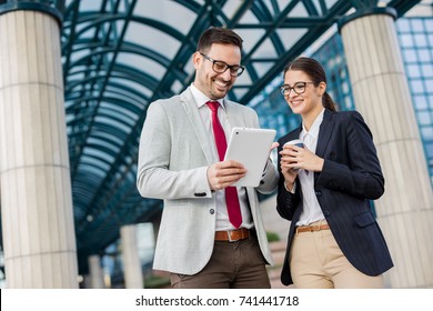 Business People Discussing Ideas At Meeting Outside.