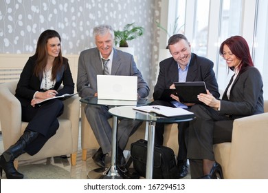 Business People Discussing In A Meeting. Shallow Depth Of Field. Please See More Photos And Video ( Business Concepts ). 