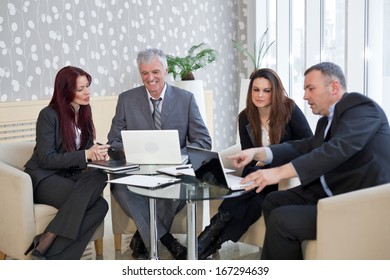 Business People Discussing In A Meeting. Shallow Depth Of Field. Please See More Photos And Video ( Business Concepts ). 