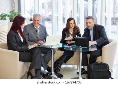 Business People Discussing In A Meeting. Shallow Depth Of Field. Please See More Photos And Video ( Business Concepts ). 