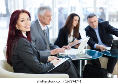 Business People Discussing In A Meeting. Shallow Depth Of Field. Please See More Photos And Video ( Business Concepts ). 