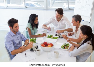 Business People Eating Lunch Together In The Office