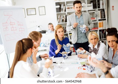 Business People Eating Meals In Office