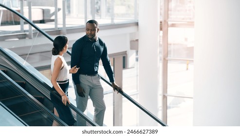 Business people, escalator and discussion with colleague for work trip, travel or career opportunity at office. Businessman and woman talking on electric staircase or lift in immigration at workplace - Powered by Shutterstock