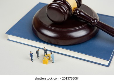 Business people explore legal and judicial risks. - Shutterstock ID 2013788084