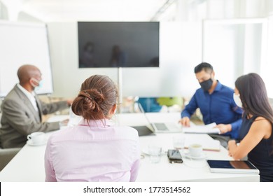 Business People With Face Mask Because Of Covid-19 In A Meeting Or Meeting