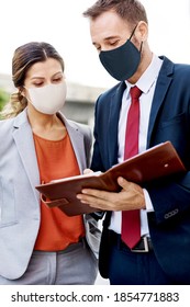 Business People In Face Mask Working In New Normal