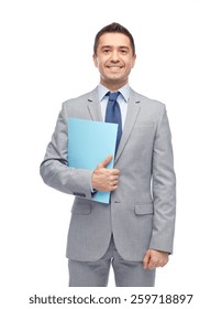 Business, People, Finances And Paper Work Concept - Happy Smiling Businessman In Suit Holding Folder