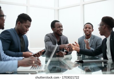 Business People Greeting Each Other During A Working Meeting.