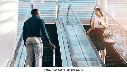 Business people, greeting and escalator with luggage at airport for work trip, travel or opportunity. Happy businessman and woman talking on electric staircase or lift for immigration with bags - Powered by Shutterstock