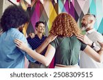 Business people, group and huddle with circle for meeting at startup, solidarity and motivation in office. Scrum, men and woman with diversity, smile and support for team with hug at creative agency