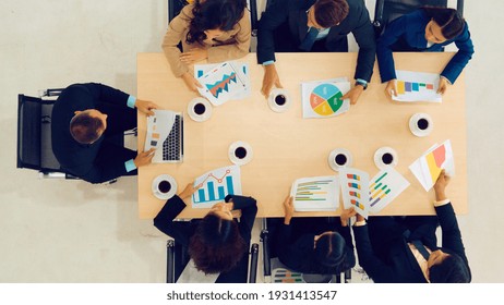 Business People Group Meeting Shot From Top View In Office . Profession Businesswomen, Businessmen And Office Workers Working In Team Conference With Project Planning Document On Meeting Table .