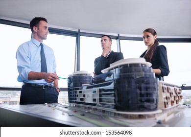 business people group on meeting and presentation  in bright modern office with construction engineer architect and worker looking building model and blueprint planbleprint plans - Powered by Shutterstock