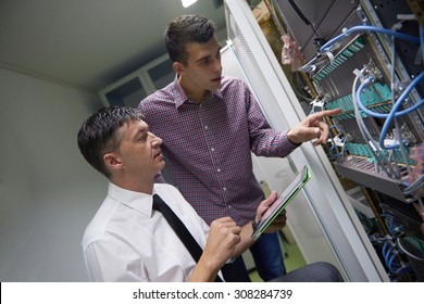 Business People Group Working On Tablet Computer, Network Engineers In Server Room