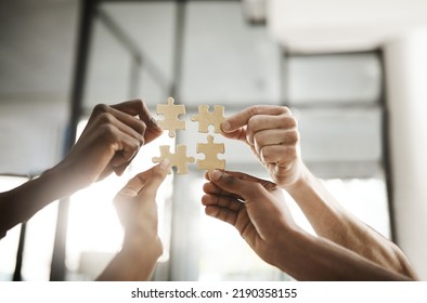 Business people hands with puzzle showing solution, problem solving and teamwork. Smart group or team activity completing, finishing a task project or assignment in difficult challenging work crisis - Shutterstock ID 2190358155