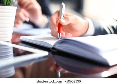 Business people hands working with papers at meeting.