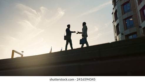 Business people, handshake and city silhouette for partnership, outdoor introduction and travel meeting. Corporate clients or men shaking hands for welcome, hello and agreement or career opportunity - Powered by Shutterstock