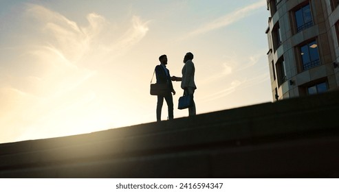 Business people, handshake and city silhouette for partnership, outdoor introduction and travel meeting. Corporate clients or men shaking hands for welcome, hello and agreement or career opportunity - Powered by Shutterstock