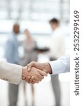 Business people, handshake and meeting for thank you, deal or agreement together at the office. Closeup, employees and shaking hands in b2b support, teamwork or partnership with welcome at workplace