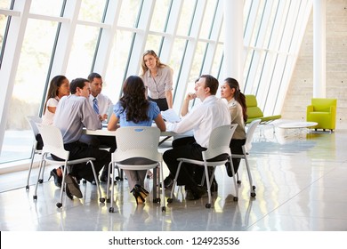 Business People Having Board Meeting In Modern Office - Powered by Shutterstock