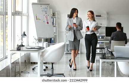 Business People Having Coffee Break In Office