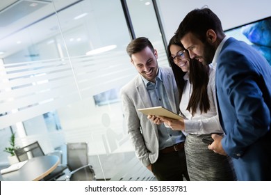 Business People Having Fun And Chatting At Workplace Office