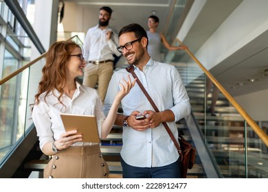 Business people having fun, teamwork and chatting at workplace office together. - Shutterstock ID 2228912477