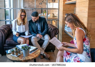 Business People Having An Informal Work Meeting Sitting On The Couch