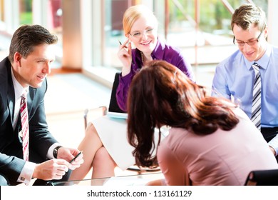 Business People Having Meeting Or Workshop In Office