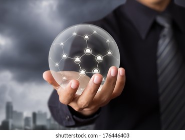 Business People Holding Social Network In Crystal Ball