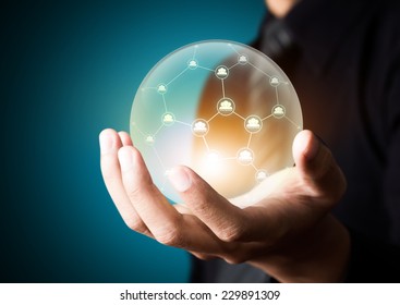 Business People Holding Social Network In Crystal Ball