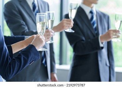 Business People Holding Sparkling Wine In Party