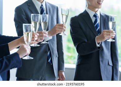 Business People Holding Sparkling Wine In Party