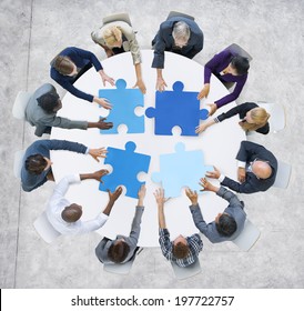 Business People and Jigsaw Puzzle Pieces - Shutterstock ID 197722757