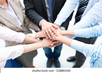 Business People Joining Hands In Circle 