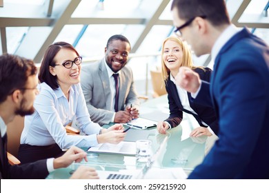 Business People Laughing Together At Meeting